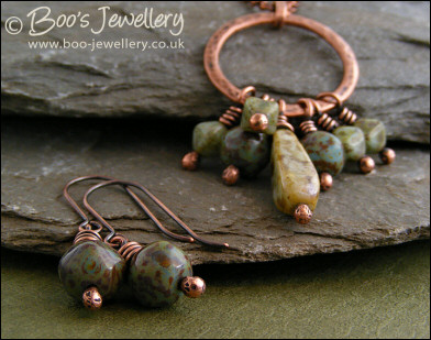 Necklace and earring set featuring a hammered circle wrapped with earthy beads