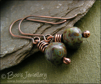 Necklace and earring set featuring a hammered circle wrapped with earthy beads