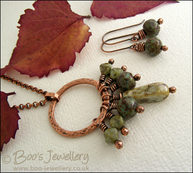 Necklace and earring set featuring a hammered circle wrapped with earthy beads
