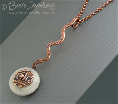 Copper and moonstone long drop squiggle pendant