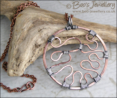 RESERVED - Copper circle pendant with Sterling silver wrapped details