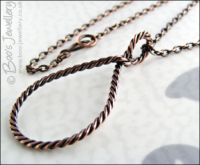Antiqued copper knotted rope loop pendant on chain