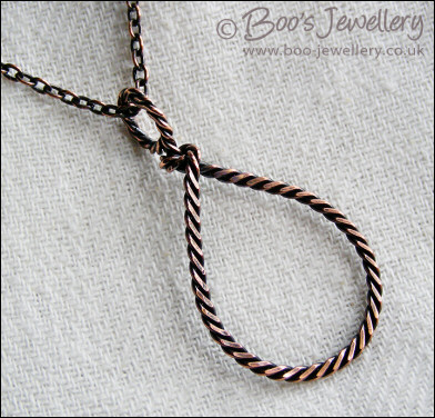 Antiqued copper knotted rope loop pendant on chain