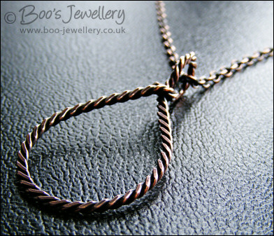 Antiqued copper knotted rope loop pendant on chain