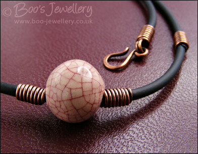 Ceramic bead, copper coils and black necklace