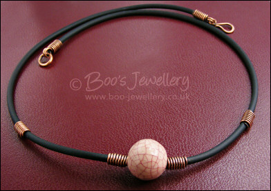 Ceramic bead, copper coils and black necklace