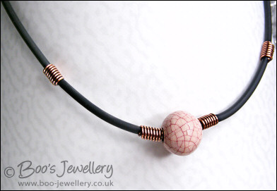 Ceramic bead, copper coils and black necklace