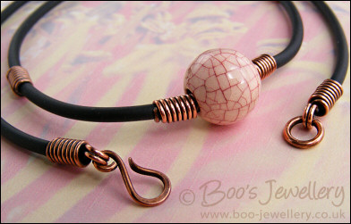 Ceramic bead, copper coils and black necklace