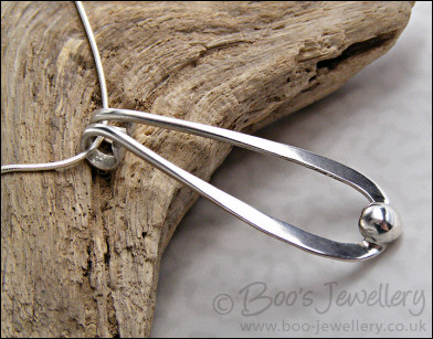 Sterling silver teardrop pendant with pebble of silver