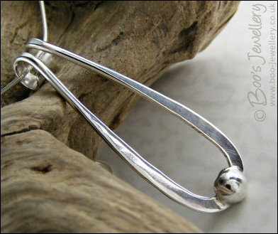 Sterling silver teardrop pendant with pebble of silver