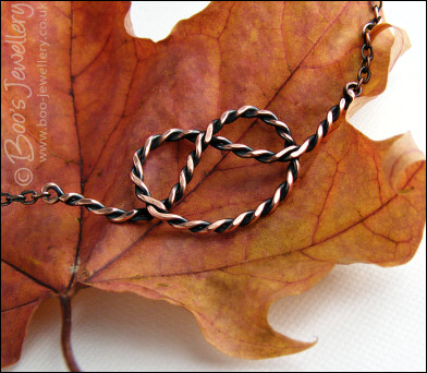 Twisted antiqued copper knot necklace