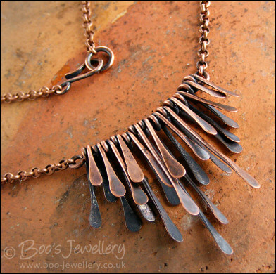 Hammered and antiqued copper paddles necklace