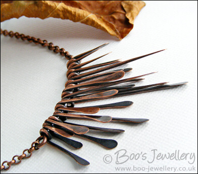 Hammered and antiqued copper paddles necklace