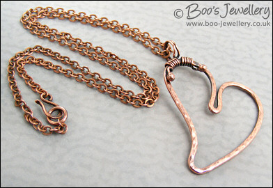 Hammered copper heart pendant with tendril bail