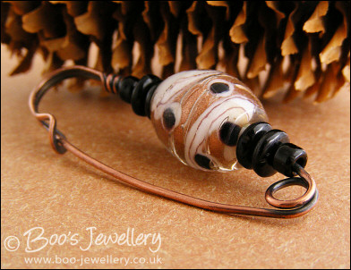 Gold, white and black copper kilt pin