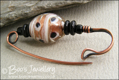 Gold, white and black copper kilt pin