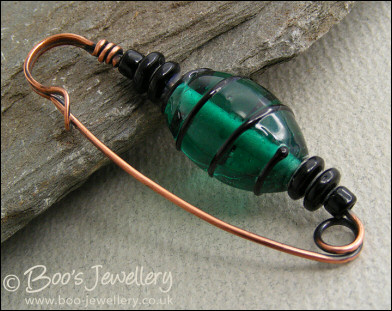 Green and black antiqued copper kilt pin